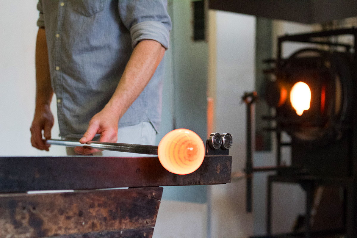 glassblowing course tutor with hot glass demonstrating