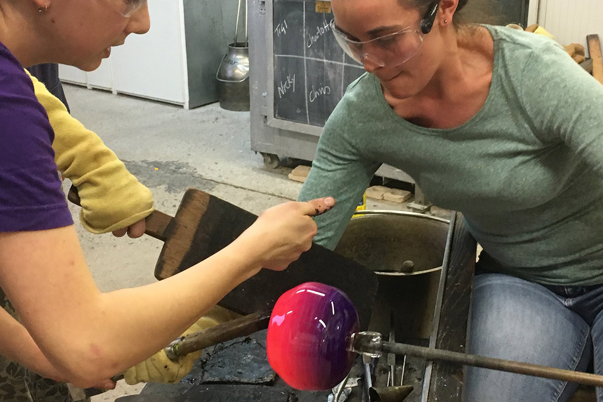 one day glassblowing beginners course student making a vase